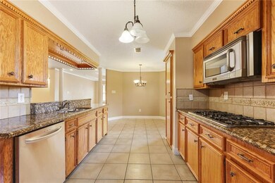 Kitchen with view of breakfast area