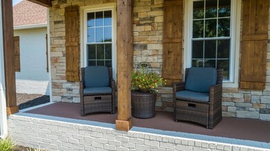 A closer view of the front porch shows a more detail of the exterior finishing touches, including the front porch with painted finish!