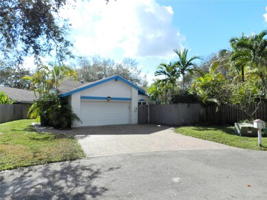 Exterior front featuring a pavered driveway and sp
