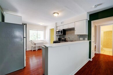 Kitchen featuring appliances with stainless steel
