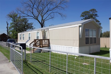 Mobile home as you enter property on left side