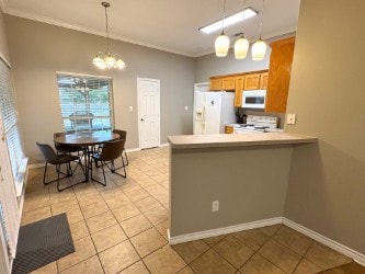 Kitchen featuring white appliances, crown molding,