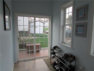 MUD ROOM WITH SLIDING DOORS TO DECK.