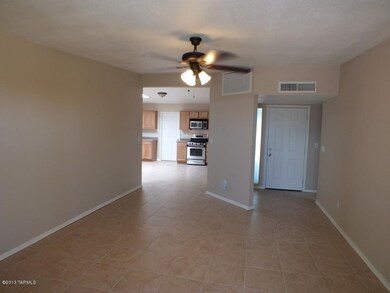 Living room towards main entry & kitchen