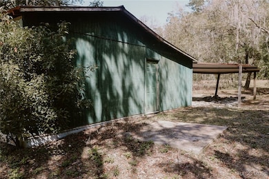 Side of detached garage with walk in door