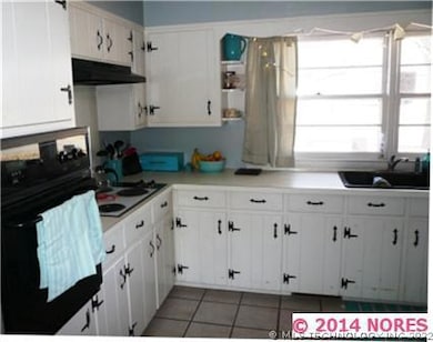Large kitchen with plenty of cabinets, countertops