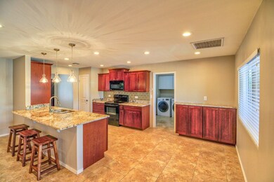 Chic pendant lights over breakfast bar