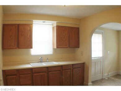 Newer Kitchen with oak cabinets, double sink, fres