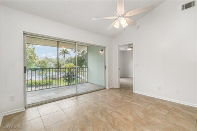 Unfurnished room featuring a ceiling fan, lofted c