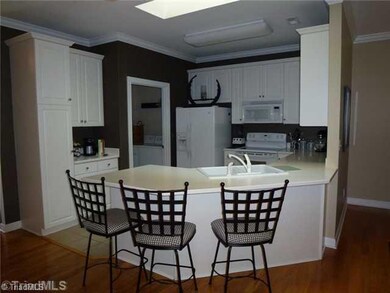 Breakfast. Enough room for 5 bar stools.  Extra Cabinets line the coffee bar and convenient mud and laundry room off garage.
