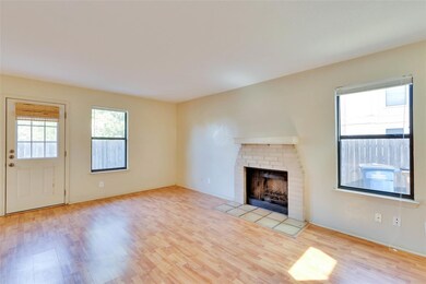 Unfurnished living room featuring wood finished f