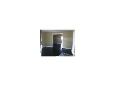 Living room looking into dining room. Bedroom 1 is