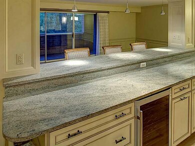Kitchen. Counter top, Wine cooler & cabinets.