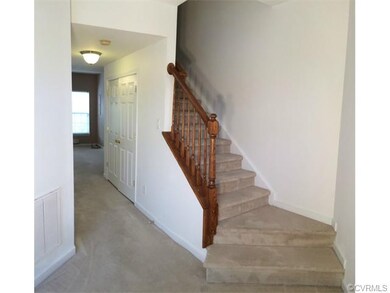Entry foyer, washer and dryer located under stairs