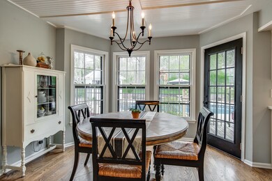 New lighting, new wood floors... gather together and feast. New Bay windows! Notice the ceiling details! 