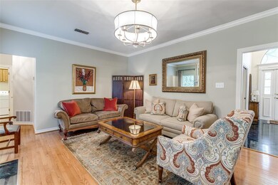 The main living room boasts original hardwood floo