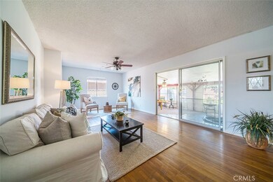 Large formal living room with real hardwood floors.