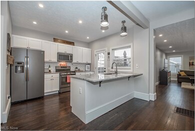 A kitchen you'll want to cook in! Impeccable marbled granite countertops and newer appliances to enjoy!