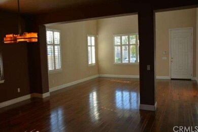View from dining room to living room and front ent