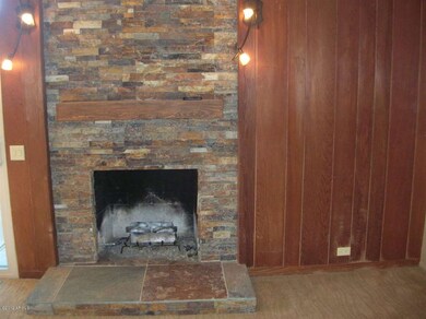 LIVING ROOM W/ STONE FIREPLACE