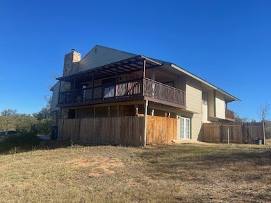 Rear view of property with a chimney