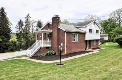 A view of this beautiful home standing by the driveway, beautiful landscaping, just waiting for you to finish!