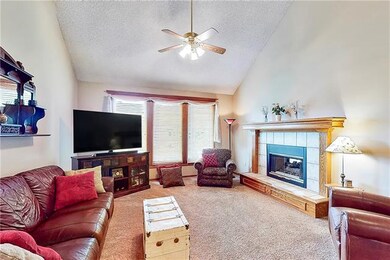 Welcoming living room with fireplace.