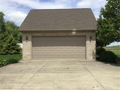 Detached all brick 2 car garage with loft storage.