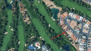 Aerial overview of property's location with a golf