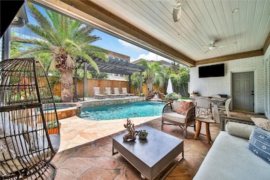 Step into your backyard oasis offering covered bac
