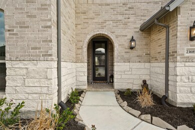 The stunning glass front door welcomes your guests.