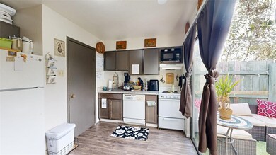 Kitchen with under cabinet range hood, white appli