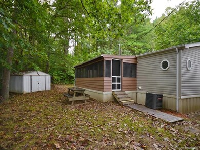 Back of home with addition of screened porch plus 