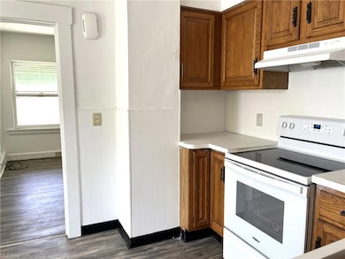 Ample cupboards and neutral paint, laminate floori