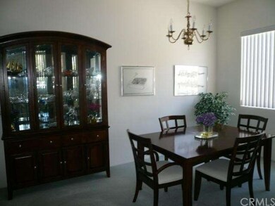 Formal dining room with upgraded carpet.