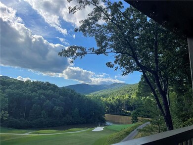Summer Season view of lake, mountains, and golf co