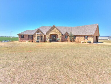 View of front of property featuring a garage, roof
