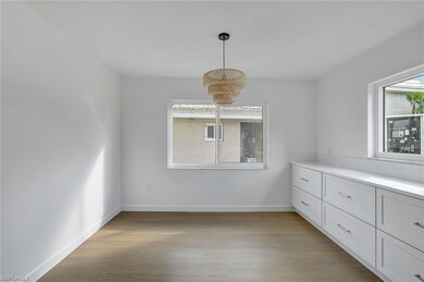 Unfurnished dining area with light wood-style floors and baseboards