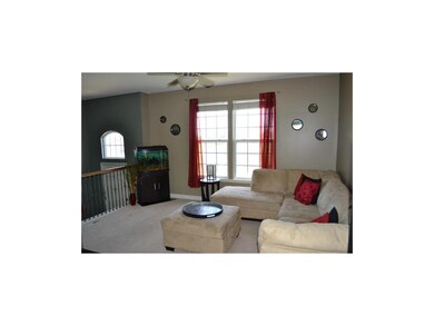 Beautiful living room, rod iron railing, bright li