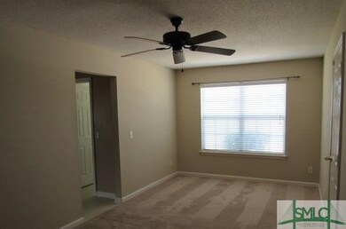 2nd living area off of kitchen with access to gara