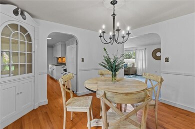 Dining room with hardwood floors and corner built-