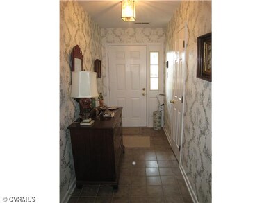 Foyer - Beautifully decorated entryway with tile f