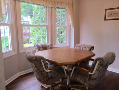 The breakfast/morning room has wood flooring and l