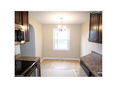 The dinette is located at the end of the kitchen