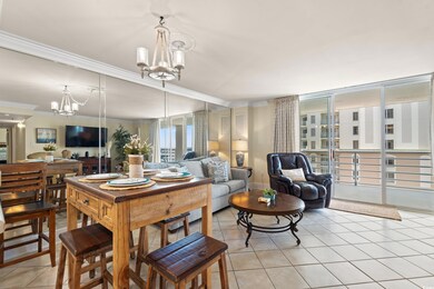 Living room with crown molding, light tile pattern