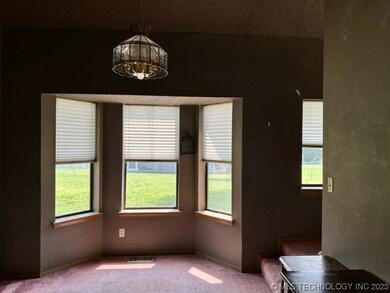 bay window dining area with vaulted ceiling