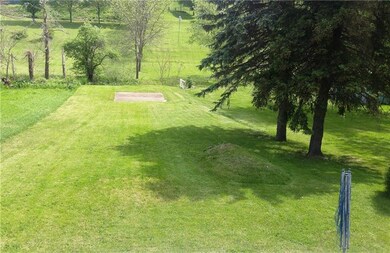 Spacious back yard leads to trout stream with a co