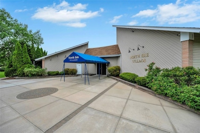 View of property featuring driveway