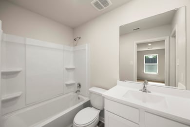 Adjacent primary bathroom with a walk-in closet!