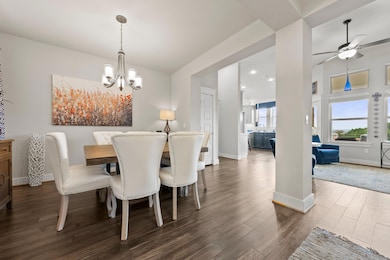 Dining room featuring dark wood finished floors, 